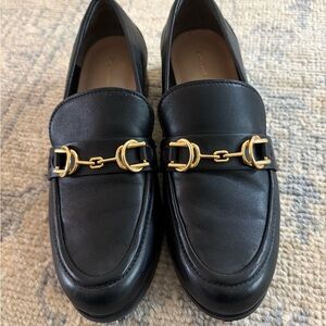 Stuart Weitzman Black Loafers with Gold Detailing